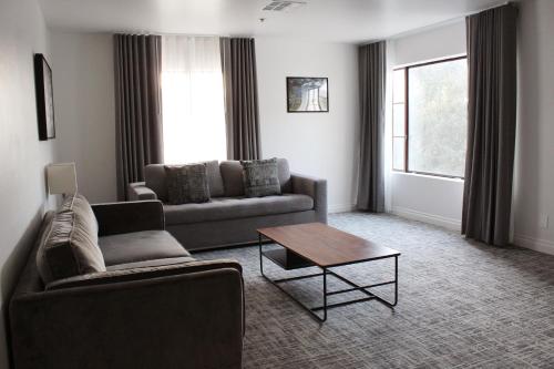 a living room with a couch and a coffee table at Vinland Hotel and Lounge in Solvang