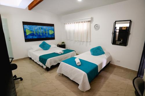 Ein Bett oder Betten in einem Zimmer der Unterkunft Hotel Lleras Premium #1