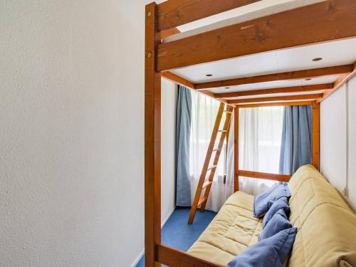 a bunk bed in a room with a ladder at Appartement La Mongie, 2 pièces, 5 personnes - FR-1-404-57 in La Mongie