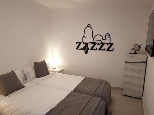 Postel nebo postele na pokoji v ubytování APARTAMENTS L’ARC