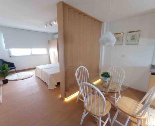 a living room with a table and chairs and a bed at Terrazas RV Adults Only No se cobran los impuestos in Posadas
