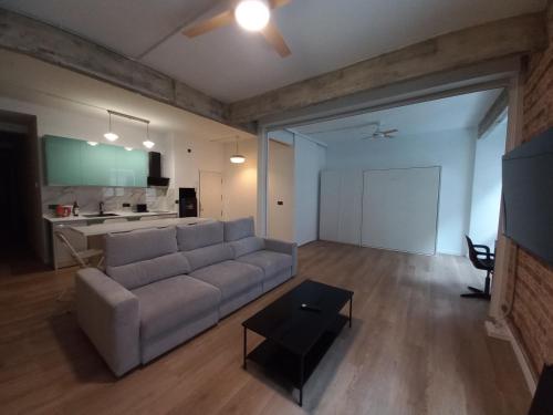 a living room with a couch and a table at MBE Premium Centro Ciudad Bilbao in Bilbao