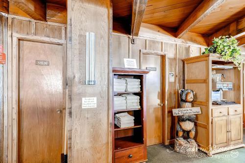 a room with a door and a shelf with towels at Outstanding Top Floor Condo, Stunning Updates with Meticulous Touches Throughout PM7C in Breckenridge