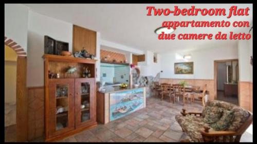 a living room with a kitchen and a dining room at Villa le Arcate in Furore