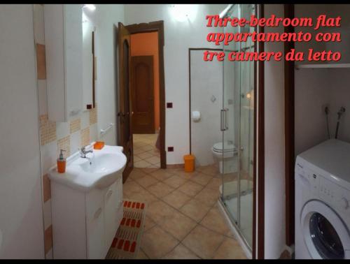 a bathroom with a sink and a washing machine at Villa le Arcate in Furore