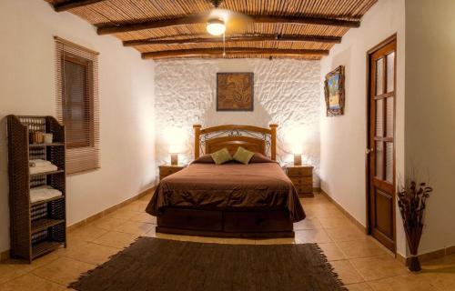 a bedroom with a bed in a room at Sauce Lodge - Laguna Azul in Sauce