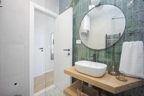 a bathroom with a sink and a mirror at Luxury Rooms Zara&Ane in Split