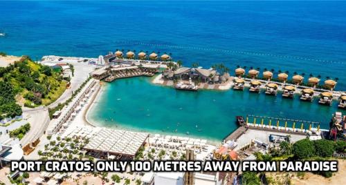 an aerial view of a resort with the words port cities only metres from paradise at Paradise in Kyrenia