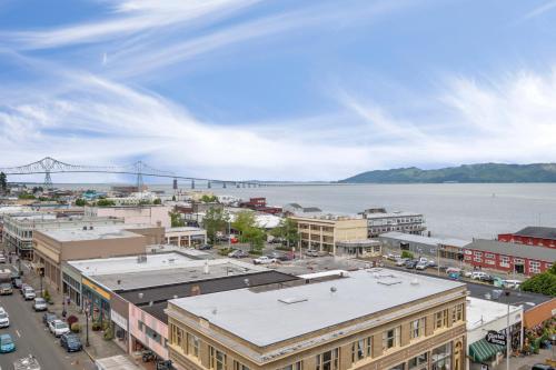 an aerial view of a city with a bridge in the background at Norblad Hotel in Astoria, Oregon