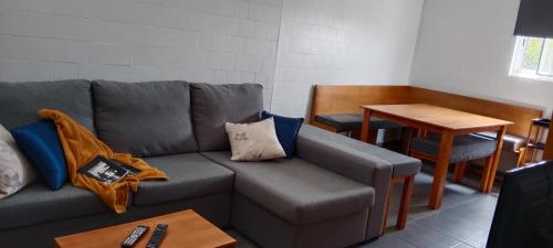 a living room with a couch and a table at Dream View in Pico in Criação Velha