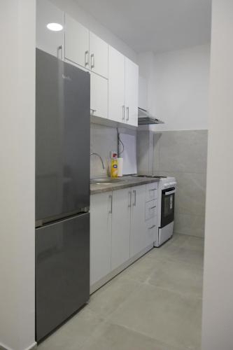 Kuchyň nebo kuchyňský kout v ubytování Porta Apartment