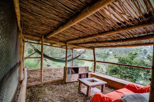 a room with a tent with a table in it at Finca Umnisa - Choachi in Choachí
