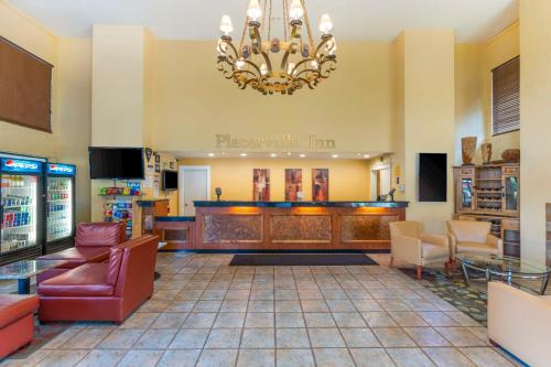 a lobby of a barber shop with a chandelier at Best Western Plus Placerville Inn in Placerville