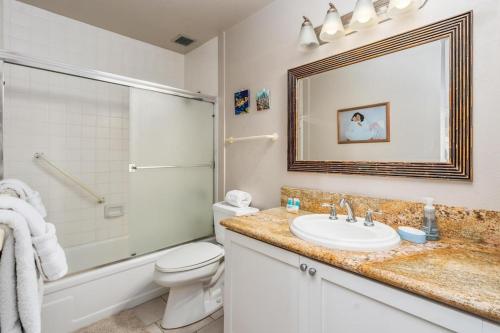 a bathroom with a sink and a toilet and a shower at New Top Hawaii Oceanfront 2BR/2BR with White Sand Beach-Kona Bali Kai 206 in Kailua-Kona