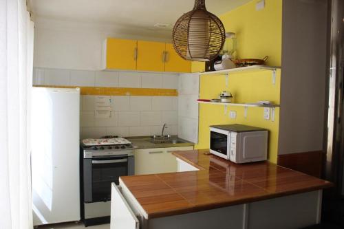 A kitchen or kitchenette at Departamentos Egaña