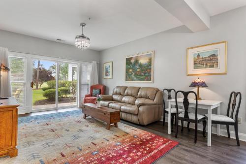 a living room with a couch and a table at Golfer's Delight at World Tour Golf in Myrtle Beach