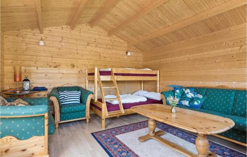 a living room with a bunk bed and a table at Cozy Home In Sveio With Wifi in Sveio