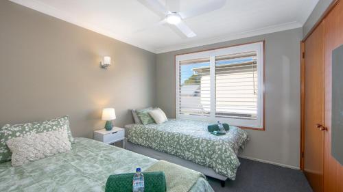 Katil atau katil-katil dalam bilik di Akuli By the Sea - Unit 1 - FNHolidays