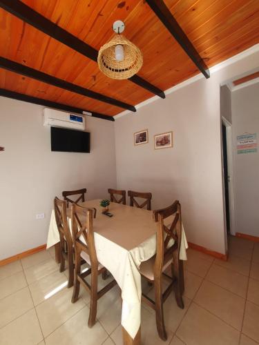 a dining room with a table and chairs at ALTOS DE LA CAÑADA in Albardón