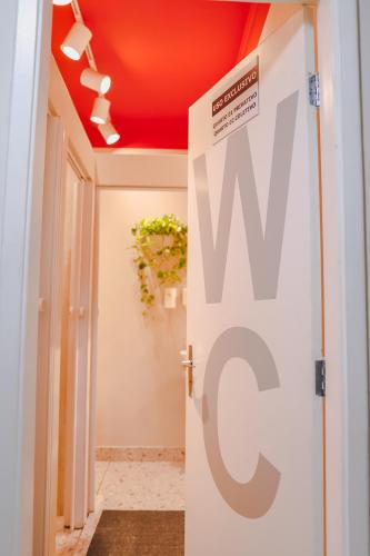 a hallway with a door with aww sign on it at Hostel new way in Sao Paulo