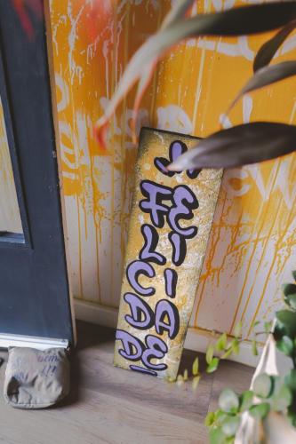 a sign that is next to a door at Hostel new way in Sao Paulo