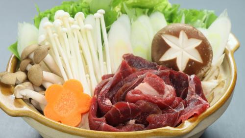 a bowl of food with vegetables and other foods at Baigetsu Ryokan in Shimo-suwa