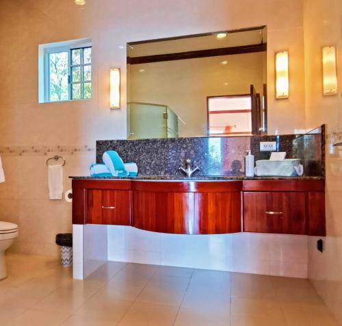 a bathroom with a sink and a mirror at Star View Boutique Resort in Dumaguete