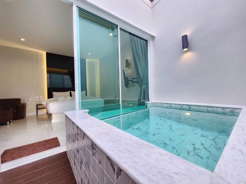 a large swimming pool in a house at PVILLA in Ban Phraek Sa