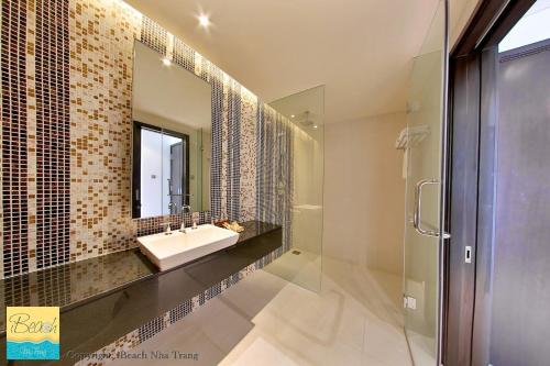 a bathroom with a sink and a mirror at Studio With SeaView in Nha Trang