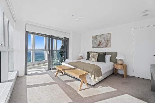 a bedroom with a bed and a view of the ocean at Jewel Beachfront Residences in Gold Coast