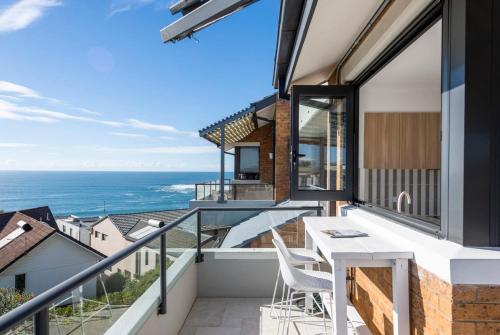 a balcony with a view of the ocean at Namanula 7 - oceanstays in Yamba