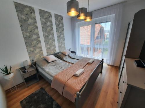 Vuode tai vuoteita majoituspaikassa Gizella Apartman