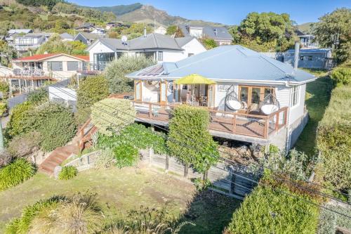 an aerial view of a house in a suburb at Harbour Views - Akaroa Holiday Home in Akaroa