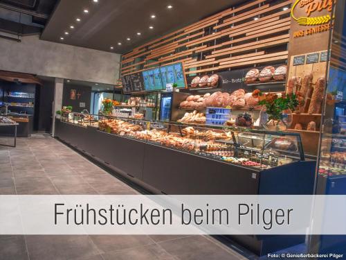 a fast food store with a bakery with the wordsfittigerben pizza at Hütte40: Ganze Hütte nah am See mit privatem Whirlpool, Sauna. Umzäunt. in Waldkirchen