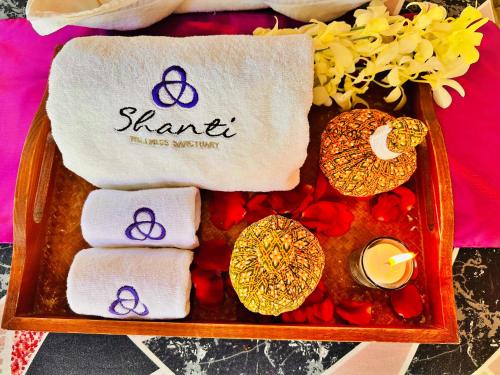 a tray with towels and the symbols of the sacred at Shanti Wellness Sanctuary in Lemery