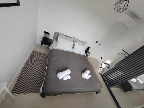 a bedroom with a large bed with two pillows at Mediterranean Vista in Dubrovnik