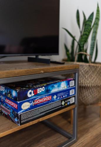 two stacks of dockedocked video game consoles on a table at At Forest Stay in Margaret River Town