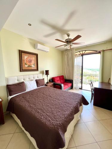 a bedroom with a bed and a ceiling fan at Oceanview Rancho with Two bedroom & Two baths in Coco