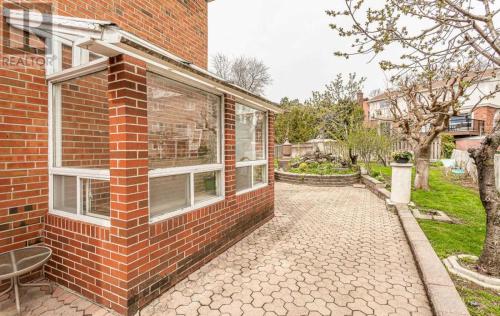 a brick house with a walkway next to a building at A Home Away-Deluxe Guest Room in Toronto in Toronto