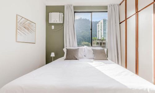 Tempat tidur dalam kamar di Tabas Lindíssimo apto na Gávea - RJ GV0001