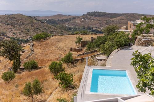 an image of a swimming pool in a villa at Kea Villa Thea- Villa Ilios in Vourkarion