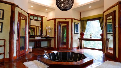 a large living room with a large couch in the middle at Katiliya Mountain Resort And Spa in Mae Salong Nai