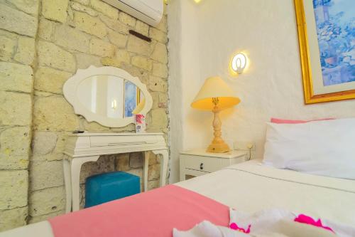 Alacati Asmali Konak Hotelにあるベッド