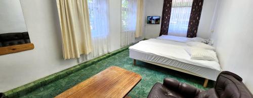 A bed or beds in a room at Palangos Kopa