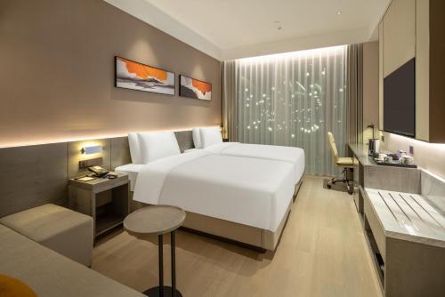 Cama o camas de una habitación en Hyatt Place Linyi People Square