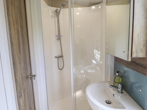 a bathroom with a shower and a sink at 5 Wilkinson Way in Lincoln