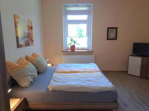 Ferienhof Schönberg tesisinde bir odada yatak veya yataklar