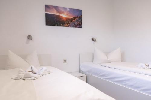 Ένα ή περισσότερα κρεβάτια σε δωμάτιο στο Familien Apartmenthotel Panoramic