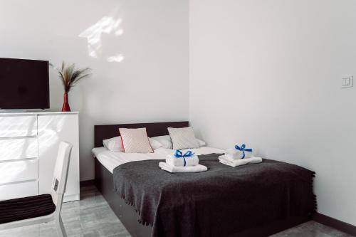 Łóżko lub łóżka w pokoju w obiekcie BlueApart Apartamenty Nexo