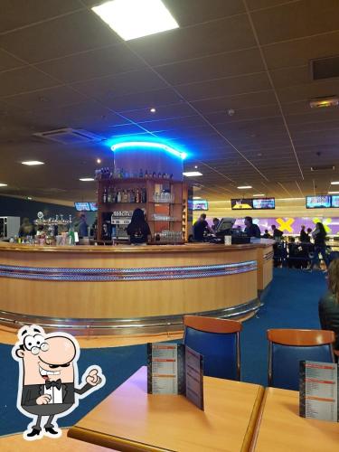 a bar with a cartoon character standing at the counter at Charming T2 in Cannes center in Cannes